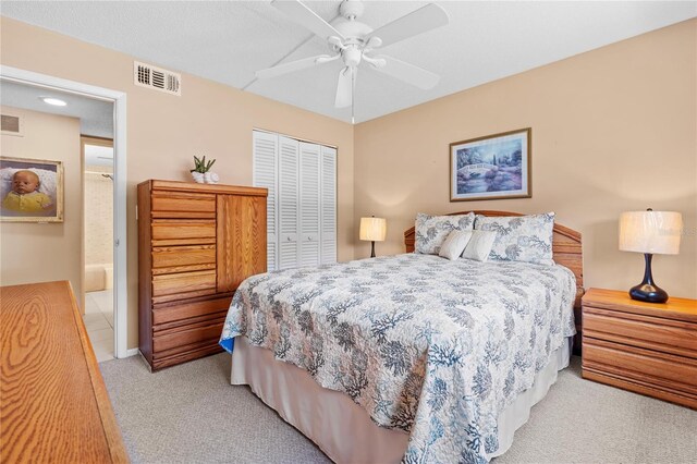2756 Clubhouse Dr Unit 101, Sarasota, FL 34232 - bedroom featuring a closet, light colored carpet, ceiling fan, and visible vents