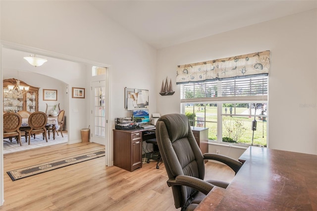 4277 E Bennett St, Inverness, FL 34453 - home office with arched walkways, high vaulted ceiling, light wood finished floors, and a notable chandelier