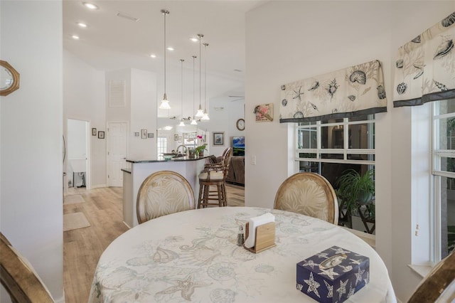 4277 E Bennett St, Inverness, FL 34453 - dining area featuring recessed lighting, light wood-style floors, and a high ceiling