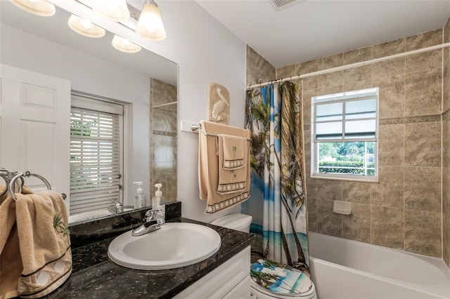 4277 E Bennett St, Inverness, FL 34453 - bathroom featuring shower / bath combination with curtain, vanity, visible vents, and toilet