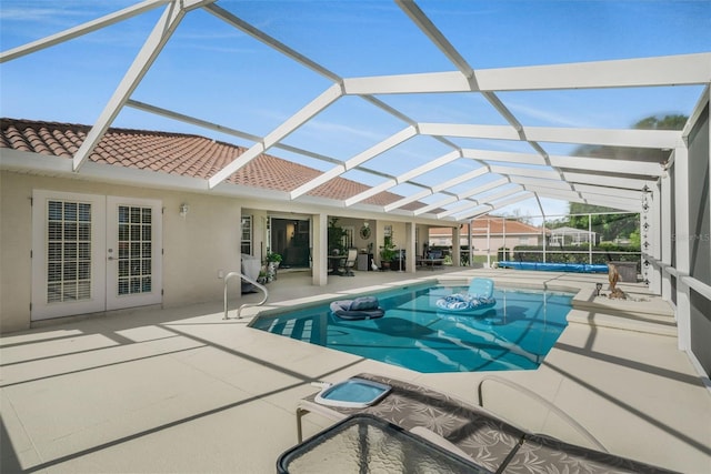 4277 E Bennett St, Inverness, FL 34453 - view of swimming pool featuring a lanai, a patio, french doors, and a covered pool