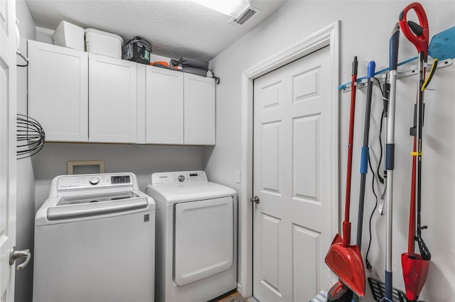4277 E Bennett St, Inverness, FL 34453 - washroom featuring cabinet space, visible vents, washer and clothes dryer, and a textured ceiling