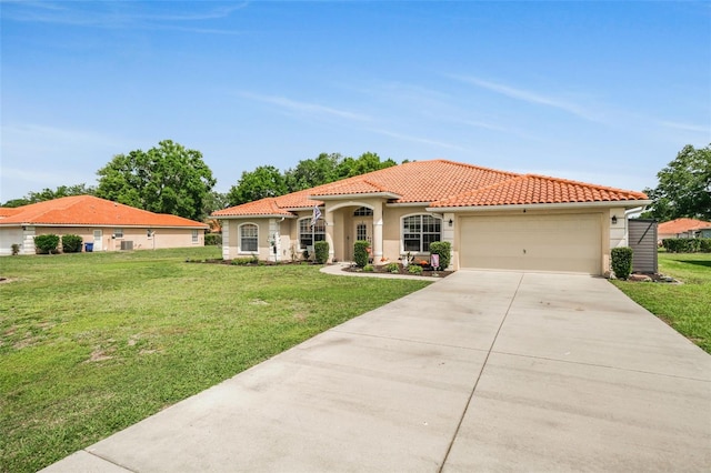 4277 E Bennett St, Inverness, FL 34453 - mediterranean / spanish house featuring concrete driveway, a tiled roof, and a front lawn
