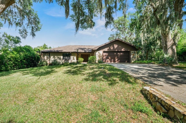 4401 E Windmill Dr, Inverness, FL 34453 - single story home with a garage, concrete driveway, and a front lawn