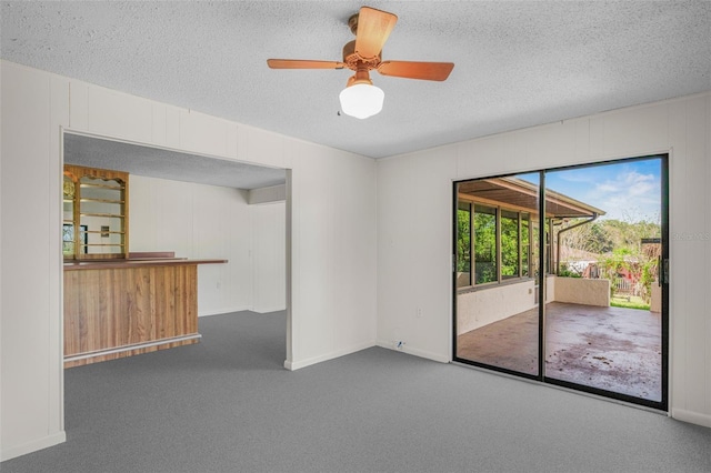 4401 E Windmill Dr, Inverness, FL 34453 - spare room featuring ceiling fan, carpet, baseboards, and a textured ceiling