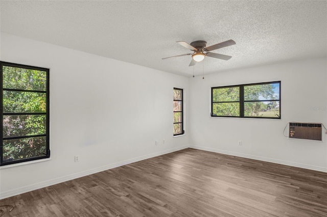 4401 E Windmill Dr, Inverness, FL 34453 - spare room with baseboards, a textured ceiling, a ceiling fan, and wood finished floors