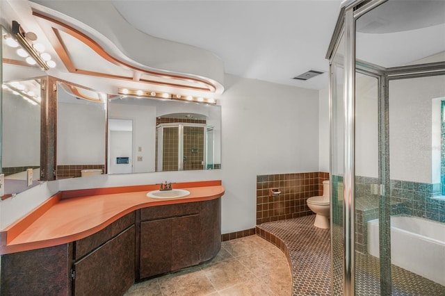 4401 E Windmill Dr, Inverness, FL 34453 - bathroom featuring vanity, a stall shower, tile patterned floors, toilet, and visible vents