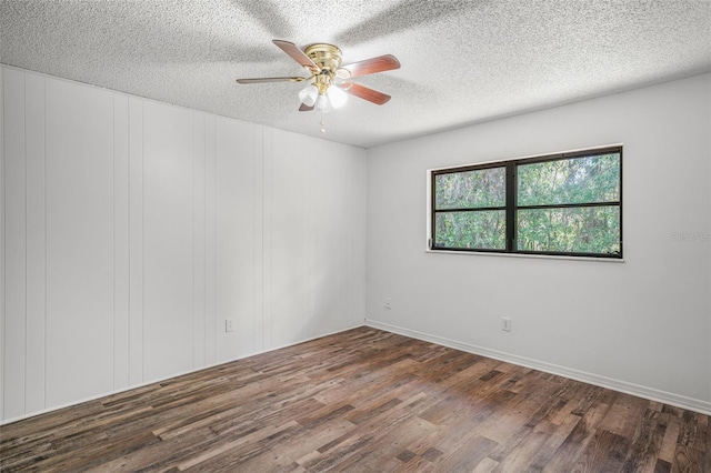 4401 E Windmill Dr, Inverness, FL 34453 - unfurnished room with ceiling fan, baseboards, wood finished floors, and a textured ceiling