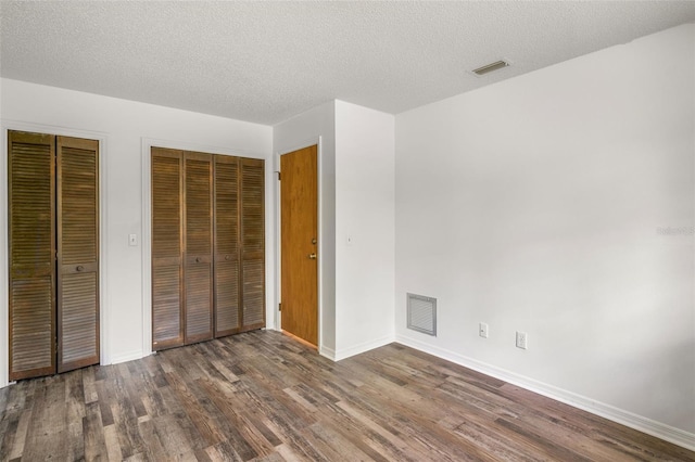 4401 E Windmill Dr, Inverness, FL 34453 - unfurnished bedroom featuring wood finished floors, baseboards, and visible vents