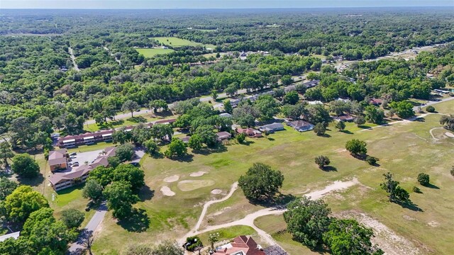 4401 E Windmill Dr, Inverness, FL 34453 - drone / aerial view with a wooded view and golf course view