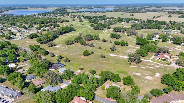 4401 E Windmill Dr, Inverness, FL 34453 - bird's eye view featuring a water view, golf course view, and a residential view