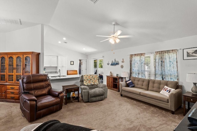 carpeted living area with recessed lighting, vaulted ceiling, visible vents, a sink, and ceiling fan