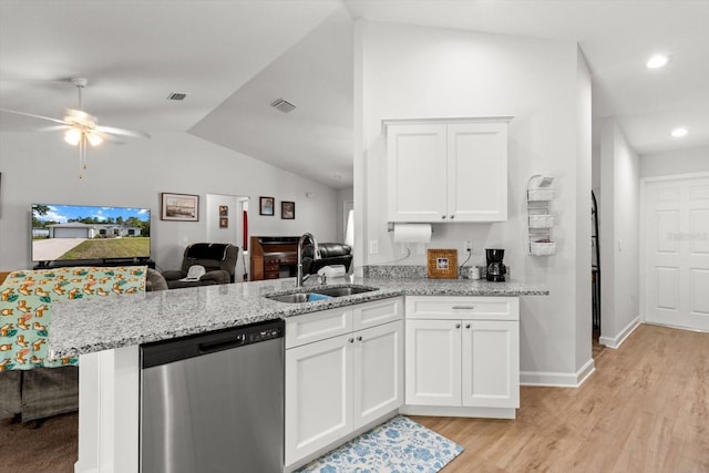 kitchen featuring a sink, open floor plan, dishwasher, white cabinets, and visible vents