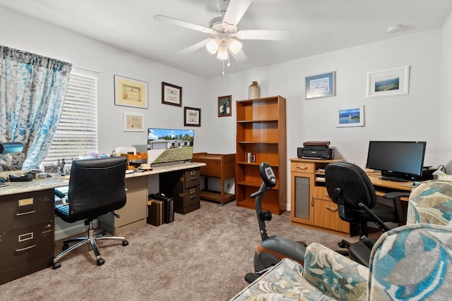office with light carpet and ceiling fan