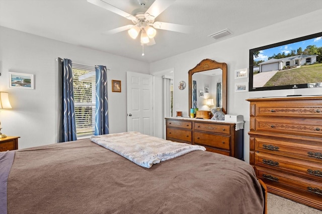 bedroom featuring visible vents and ceiling fan