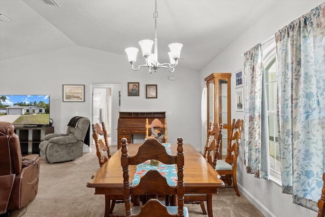 carpeted dining room featuring lofted ceiling, visible vents, baseboards, and an inviting chandelier
