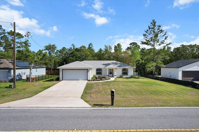 single story home with concrete driveway, fence, a front yard, and a garage