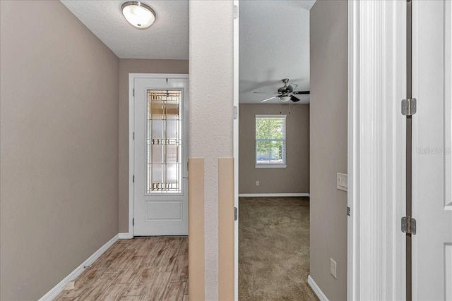 3918 NW 46th Ter, Ocala, FL 34482 - doorway to outside with light wood-type flooring, a ceiling fan, and baseboards