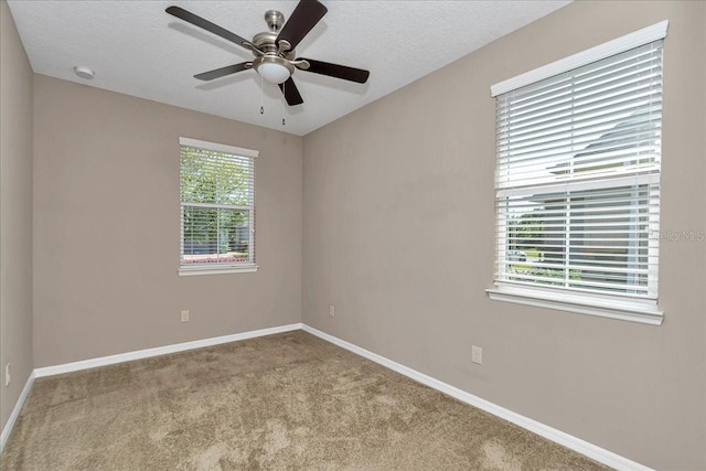 3918 NW 46th Ter, Ocala, FL 34482 - empty room featuring a ceiling fan, a textured ceiling, carpet, and baseboards