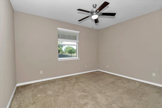 3918 NW 46th Ter, Ocala, FL 34482 - unfurnished room featuring baseboards, ceiling fan, a textured ceiling, and carpet flooring