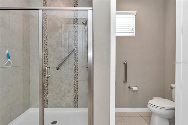 3918 NW 46th Ter, Ocala, FL 34482 - bathroom featuring baseboards, a stall shower, toilet, and tile patterned flooring