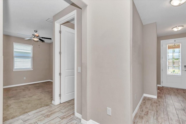 3918 NW 46th Ter, Ocala, FL 34482 - foyer with a healthy amount of sunlight, ceiling fan, light wood finished floors, and baseboards