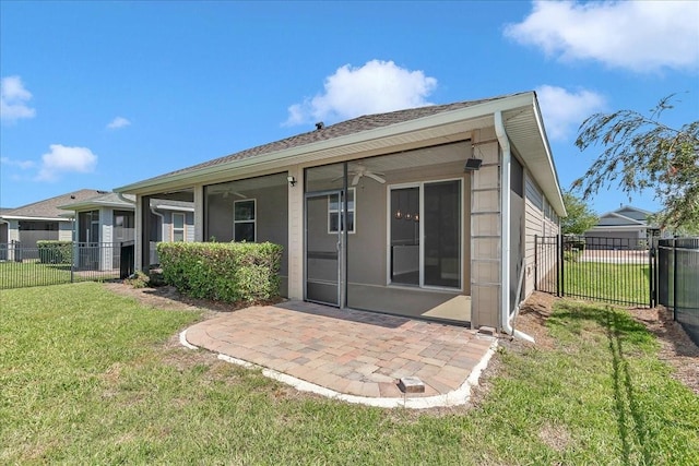3918 NW 46th Ter, Ocala, FL 34482 - back of house featuring a lawn, a ceiling fan, a patio, and fence