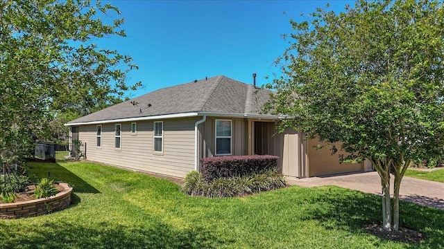3918 NW 46th Ter, Ocala, FL 34482 - view of home's exterior featuring driveway, a yard, and a shingled roof
