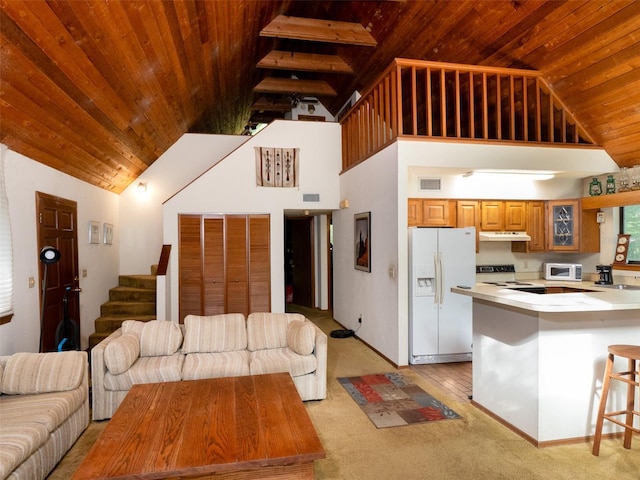 11420 NW 110th Ave, Reddick, FL 32686 - living area with wood ceiling, visible vents, high vaulted ceiling, and light carpet