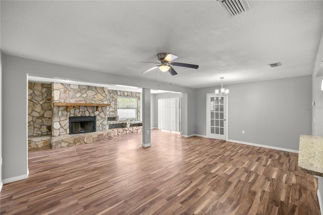 15044 SW 35th Avenue Rd, Ocala, FL 34473 - unfurnished living room featuring visible vents, ceiling fan with notable chandelier, and wood finished floors