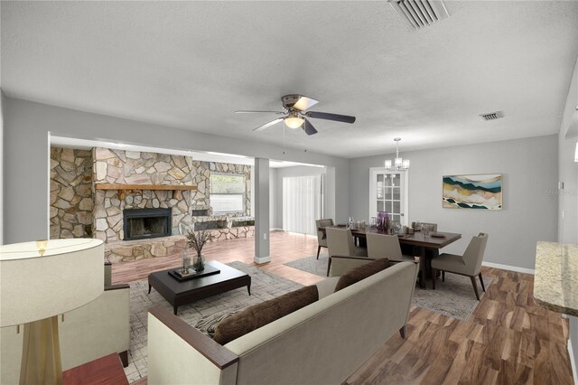 15044 SW 35th Avenue Rd, Ocala, FL 34473 - living room featuring visible vents, ceiling fan with notable chandelier, and a textured ceiling