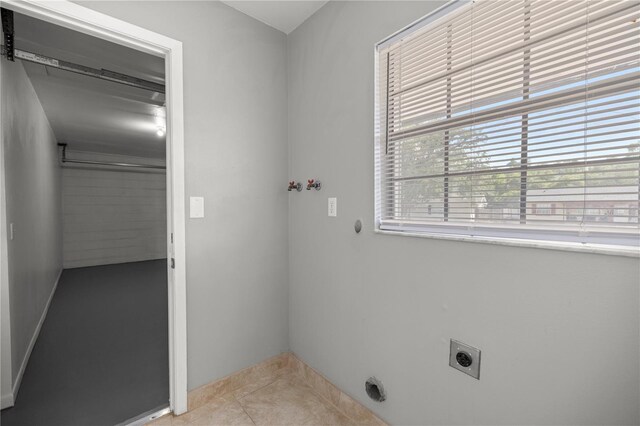 15044 SW 35th Avenue Rd, Ocala, FL 34473 - washroom featuring baseboards, laundry area, hookup for an electric dryer, tile patterned floors, and hookup for a washing machine