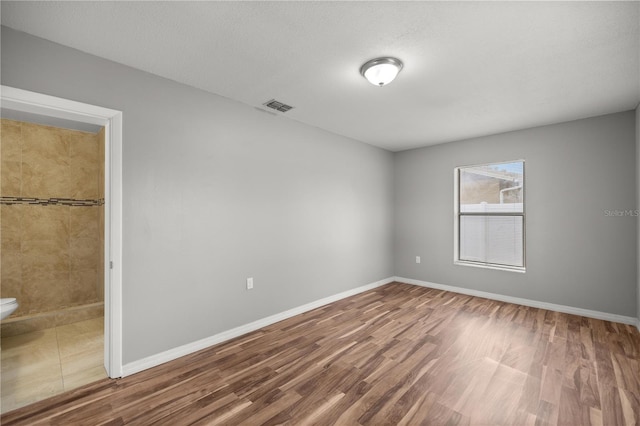 15044 SW 35th Avenue Rd, Ocala, FL 34473 - spare room with visible vents, baseboards, and wood finished floors
