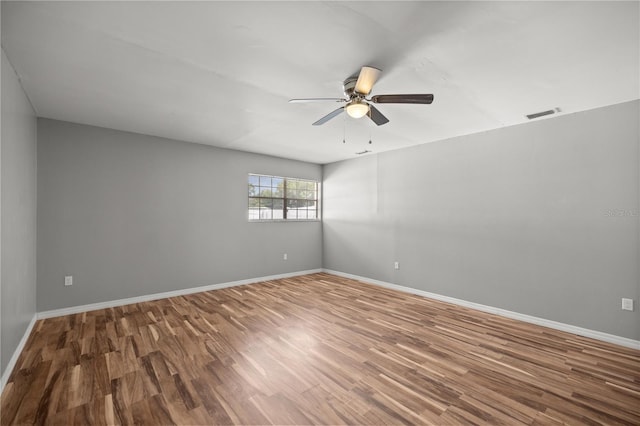 15044 SW 35th Avenue Rd, Ocala, FL 34473 - empty room featuring visible vents, ceiling fan, wood finished floors, and baseboards