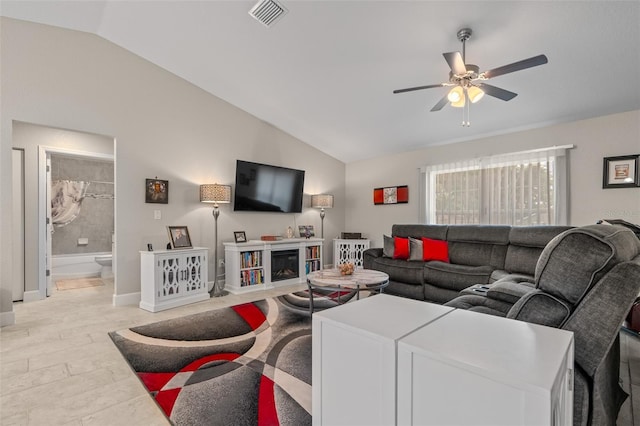 7886 SW 103rd Loop, Ocala, FL 34476 - living room featuring visible vents, ceiling fan, vaulted ceiling, and baseboards