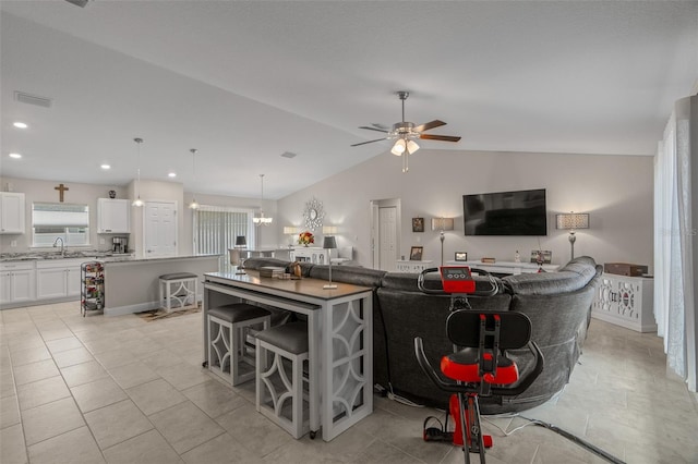 7886 SW 103rd Loop, Ocala, FL 34476 - living room featuring recessed lighting, ceiling fan with notable chandelier, visible vents, light tile patterned flooring, and lofted ceiling