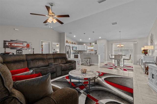 7886 SW 103rd Loop, Ocala, FL 34476 - living area with light tile patterned floors, visible vents, vaulted ceiling, and ceiling fan with notable chandelier