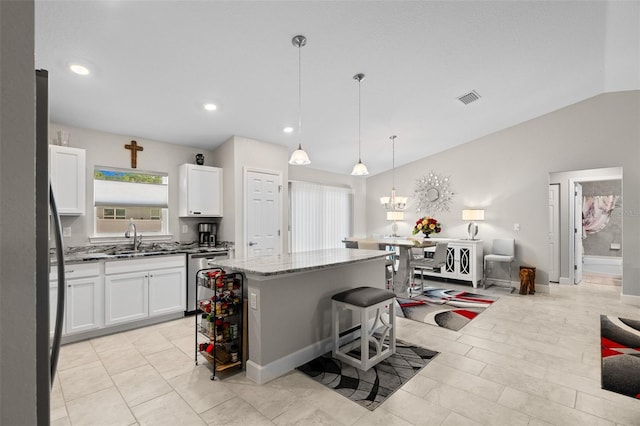 7886 SW 103rd Loop, Ocala, FL 34476 - kitchen featuring a sink, visible vents, a kitchen island, vaulted ceiling, and dishwasher