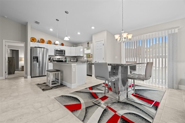 7886 SW 103rd Loop, Ocala, FL 34476 - interior space with a chandelier, appliances with stainless steel finishes, a kitchen island, a sink, and visible vents