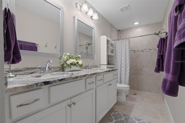 7886 SW 103rd Loop, Ocala, FL 34476 - full bath with toilet, a sink, tiled shower, and visible vents