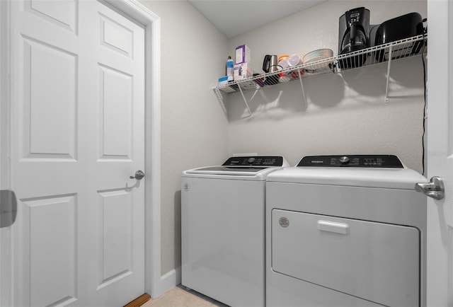 7886 SW 103rd Loop, Ocala, FL 34476 - clothes washing area featuring washing machine and clothes dryer, laundry area, and baseboards