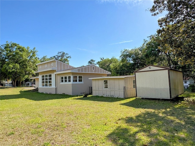 rear view of house with a yard
