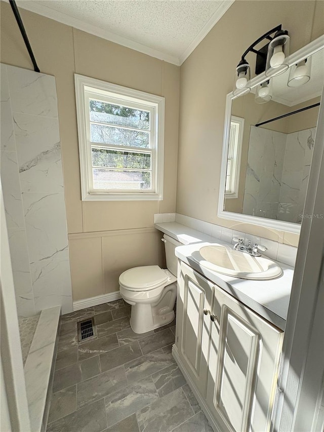bathroom featuring a marble finish shower, toilet, and vanity