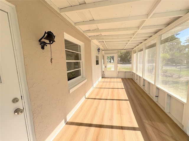 unfurnished sunroom with a wealth of natural light