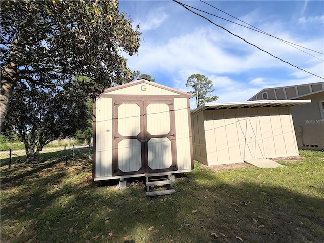 view of shed with fence