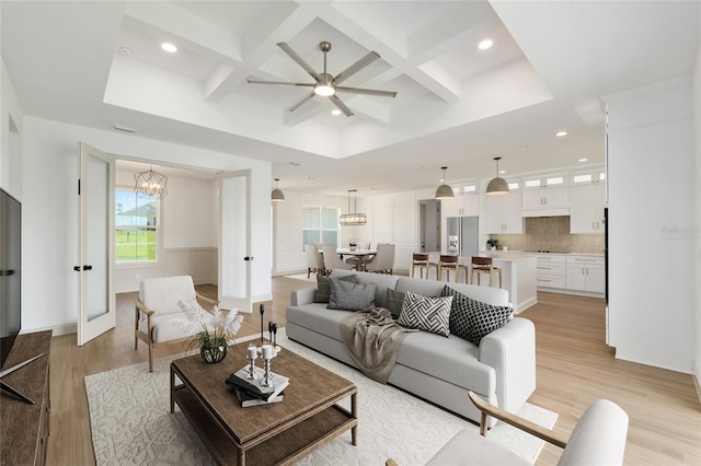 1784 NW 85th Loop, Ocala, FL 34475 - living room with coffered ceiling, light wood-style floors, recessed lighting, a chandelier, and ceiling fan