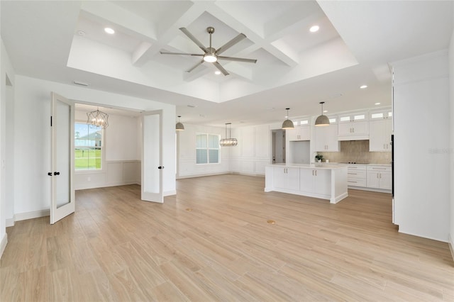 1784 NW 85th Loop, Ocala, FL 34475 - unfurnished living room featuring coffered ceiling, a chandelier, recessed lighting, a ceiling fan, and beam ceiling