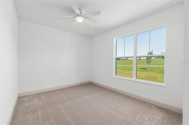 1784 NW 85th Loop, Ocala, FL 34475 - carpeted empty room with a ceiling fan and baseboards