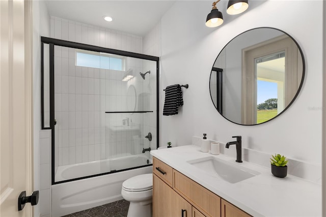 1784 NW 85th Loop, Ocala, FL 34475 - full bath featuring healthy amount of natural light, vanity, toilet, shower / bath combination with glass door, and recessed lighting