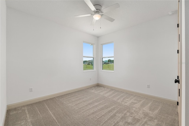 1784 NW 85th Loop, Ocala, FL 34475 - spare room with light colored carpet, baseboards, and ceiling fan